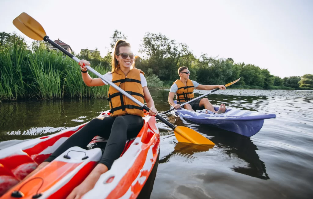 couple-together-kayaking-river